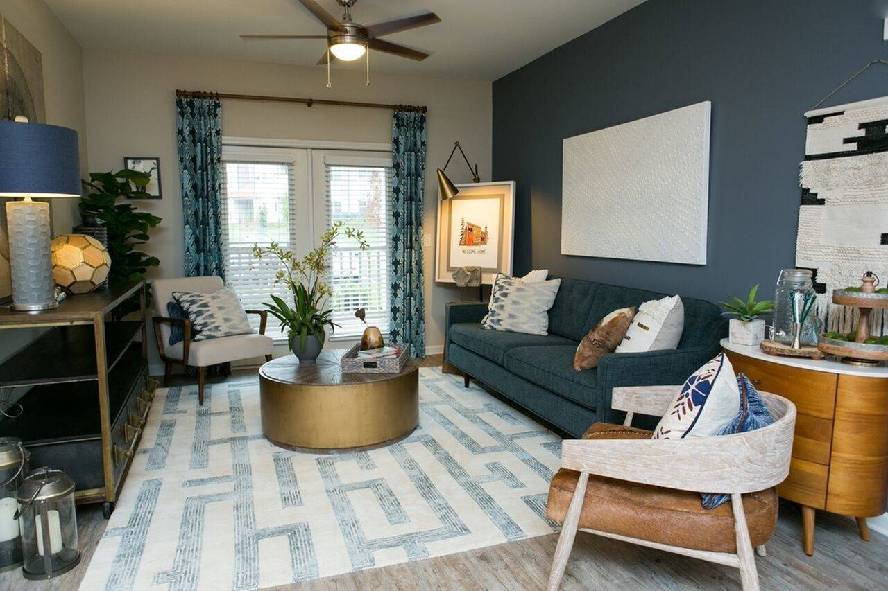 Living rooms with patio access and ceiling fans