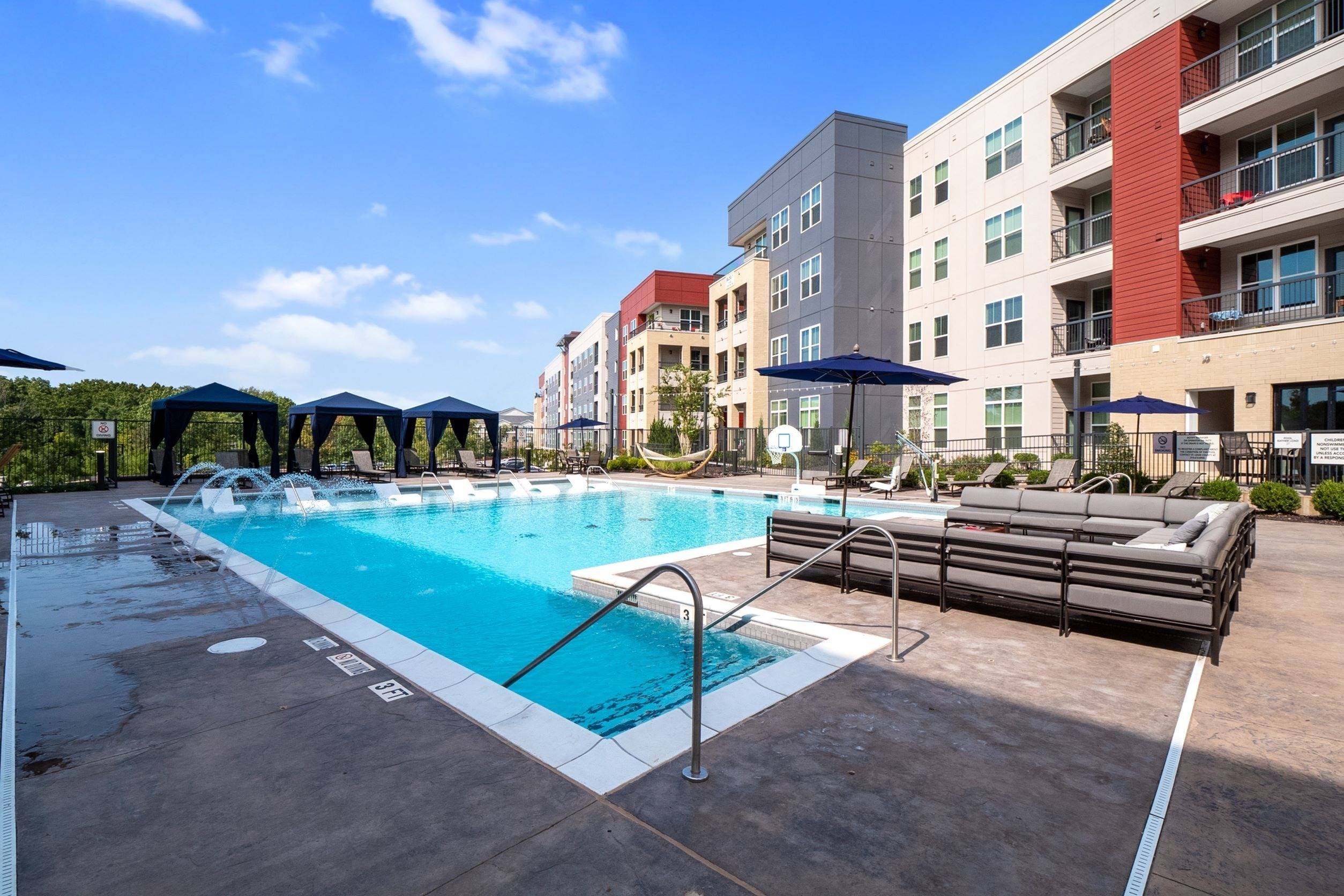 Resort-style pool with sundeck and cabanas