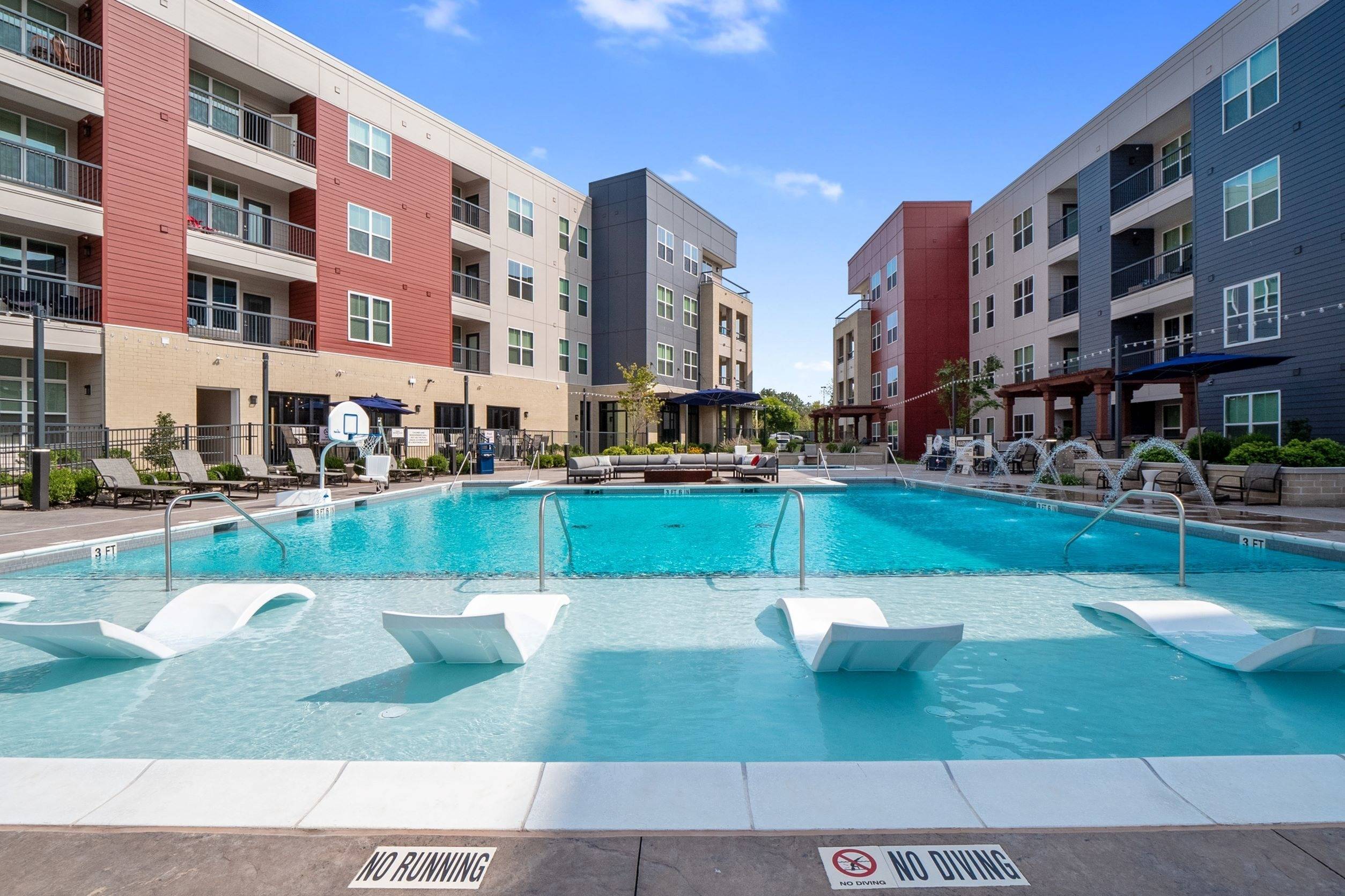 Resort-style pool and sun shelf with lounges