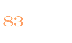 Contemporary logo with a sleek design, featuring the number 83 in vibrant orange alongside a modern, minimalist font.