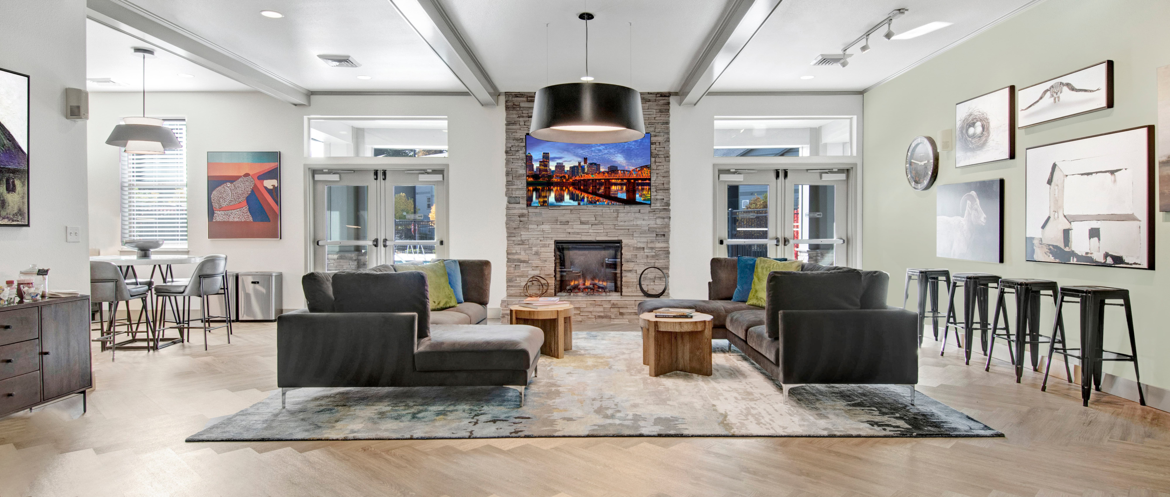 River Ridge Clubhouse with chairs and a fireplace and paintings on the wall