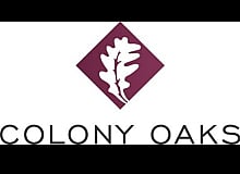 Elegant Colony Oaks logo featuring a stylized oak leaf set in a maroon diamond shape.