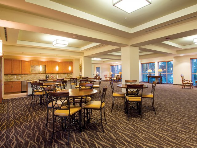 Gaming room with 4 top table seating and serving kitchen for events