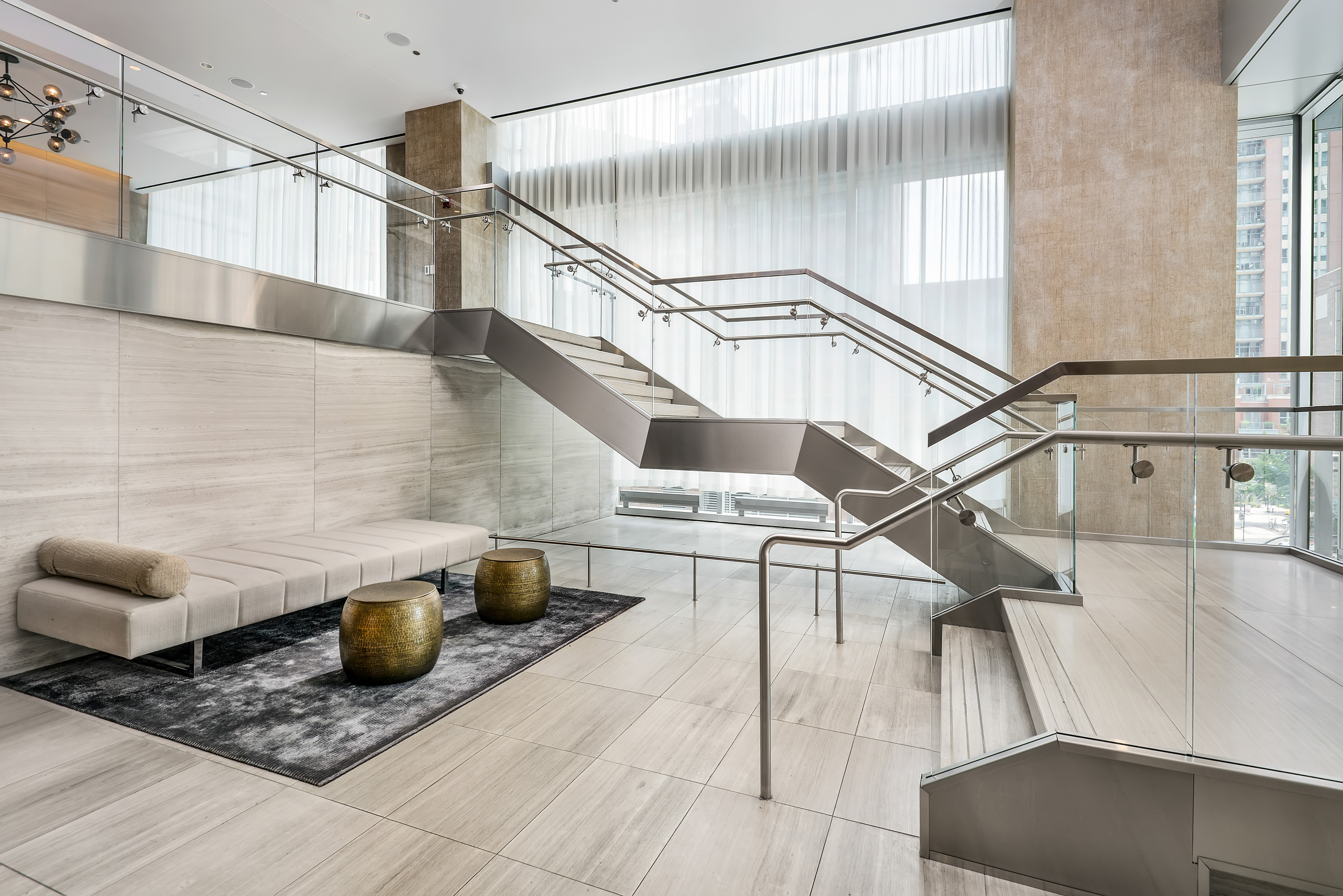 Lobby with stairs leading to a lounge area