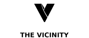 Sleek logo design of The Vicinity featuring a bold, modern V shape.