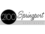 Elegant black and white logo of 2100 Springport Apartments showcasing modern font design.