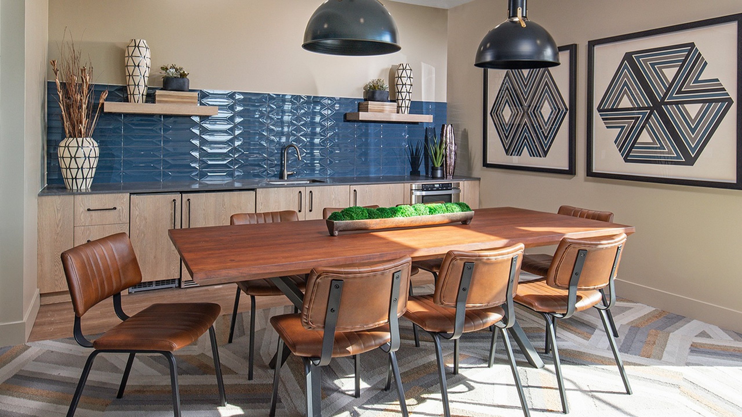 Chic dining room with a wooden table, modern chairs, and artistic decor featuring geometric patterns.