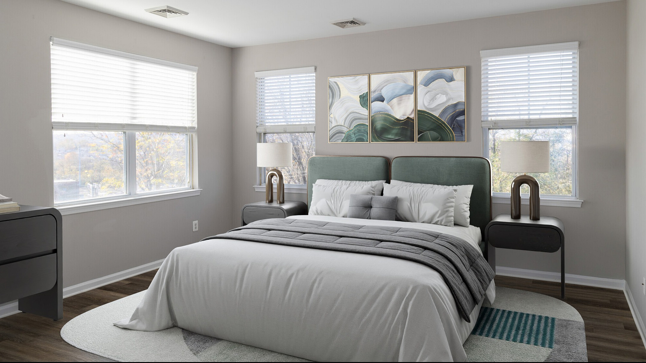 Bright and inviting bedroom with modern decor, featuring a plush bed, elegant side tables, and large windows offering natural light.