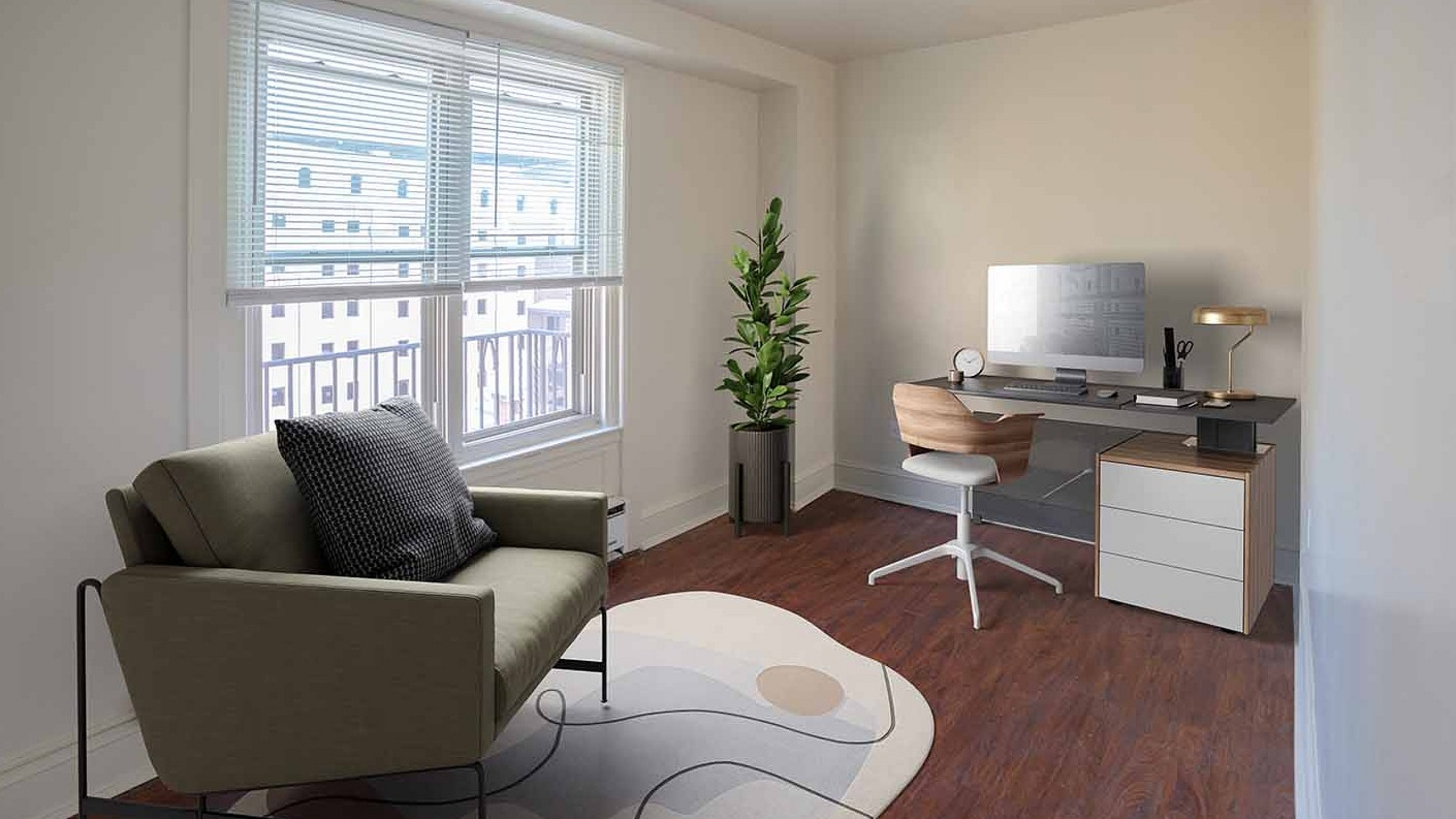 Bright home office with large window, cozy seating, stylish desk, and lush plant accent.