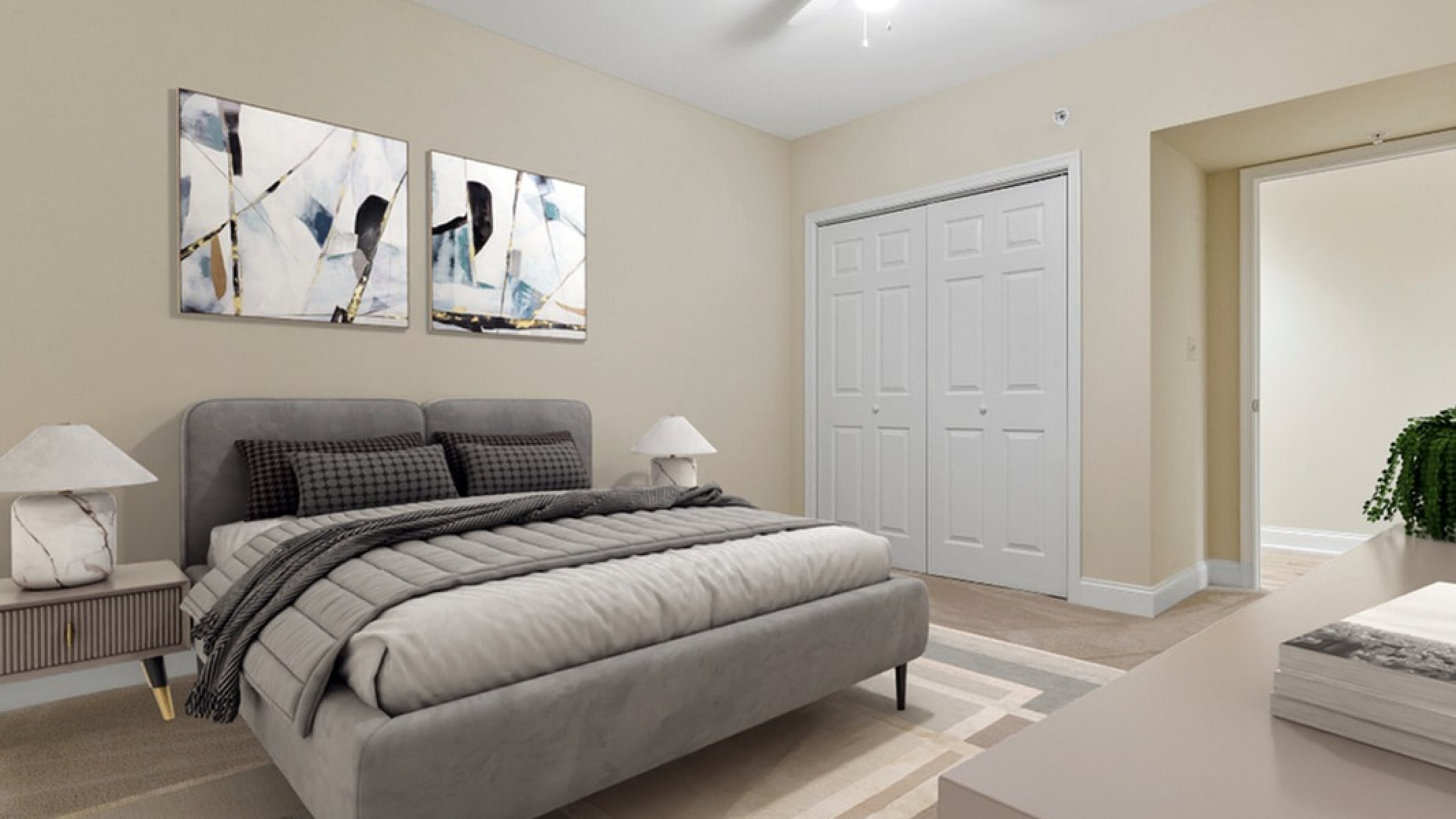 Inviting bedroom with chic decor, featuring a plush gray bed, contemporary art, and ample closet space.