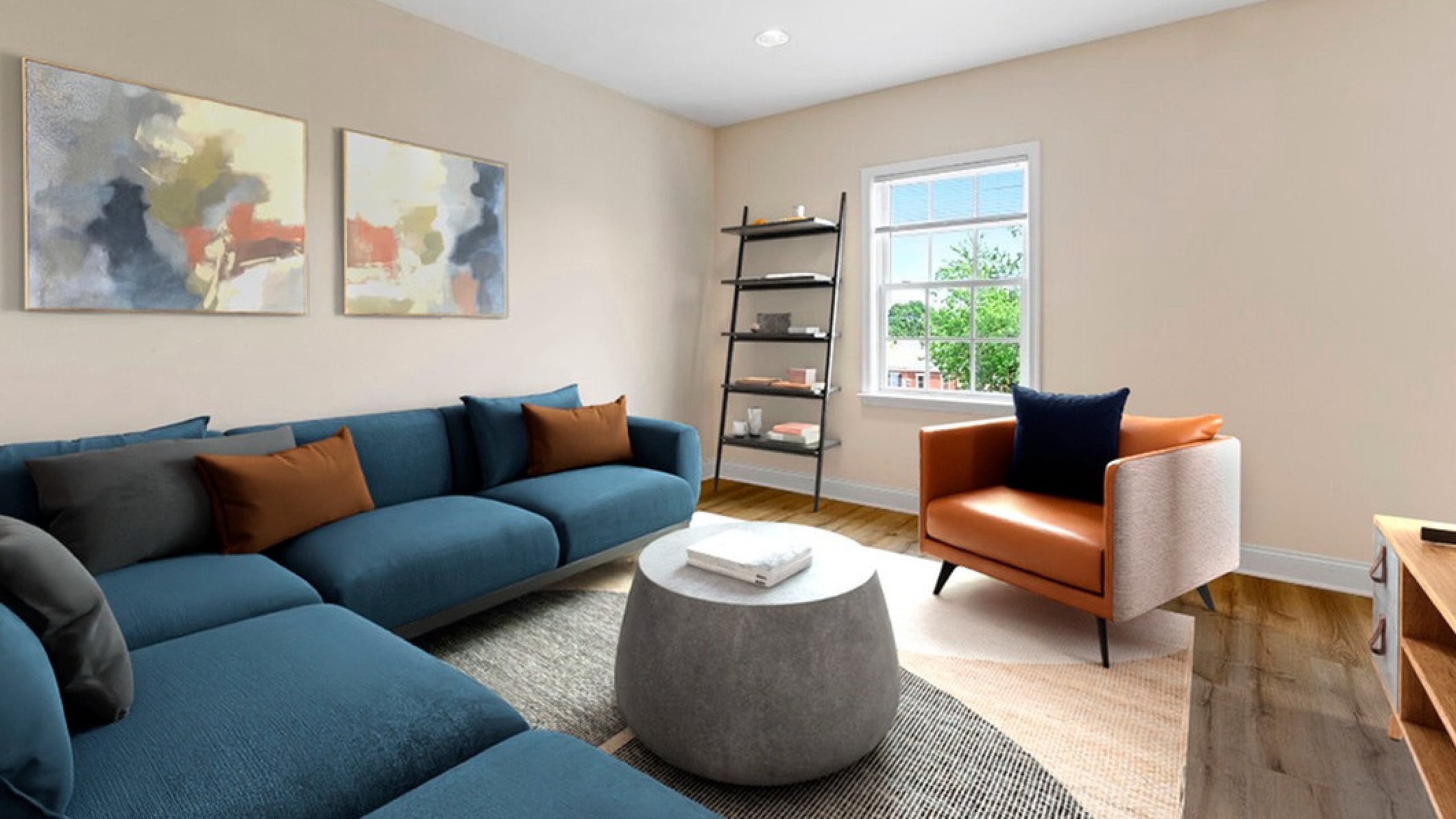 Chic living room with modern blue sofa, elegant artwork, and a cozy ambiance. A bright window offers natural light, complemented by a stylish orange armchair and trendy shelving.