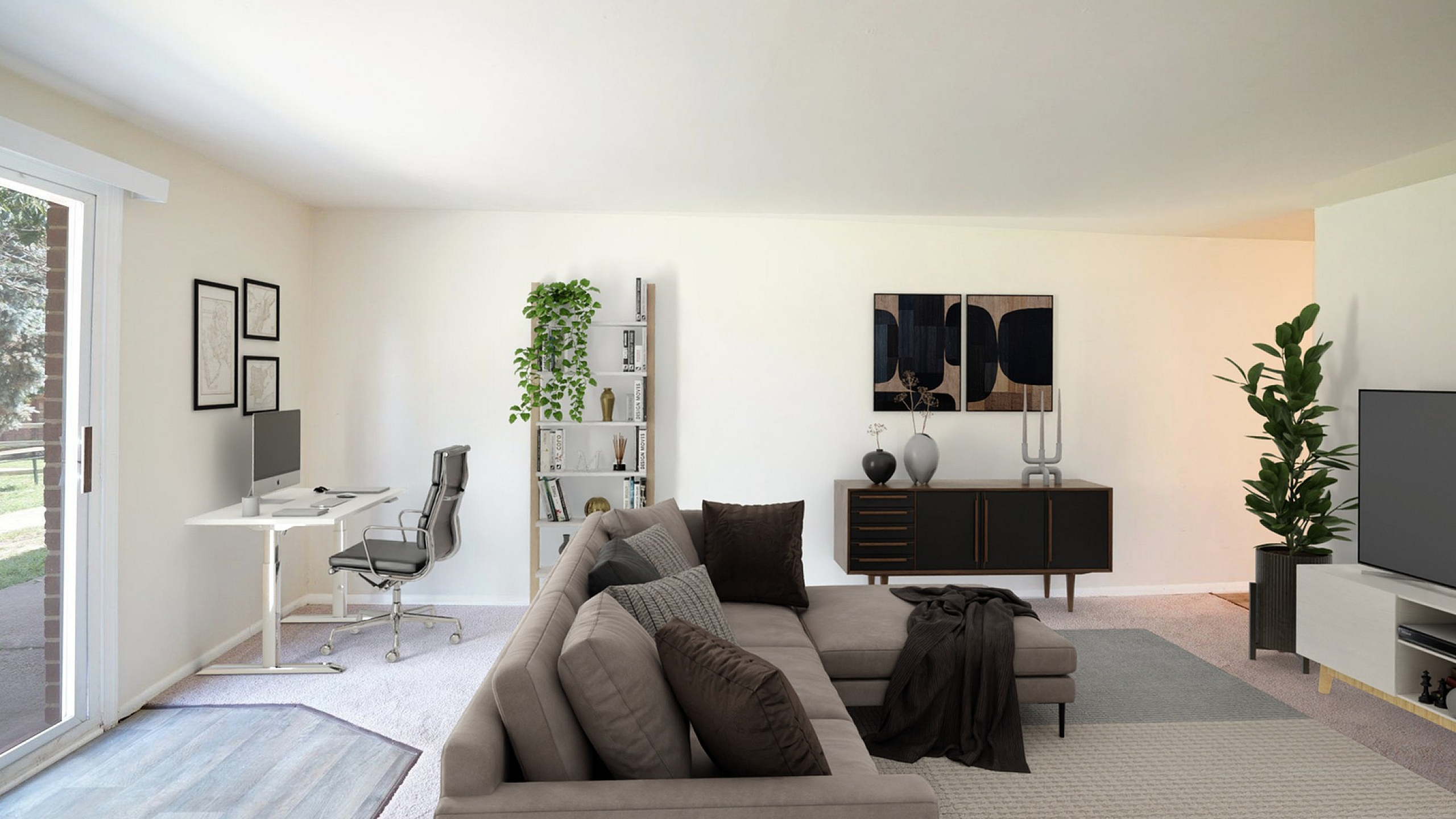 Bright and spacious living room with cozy sectional sofa, elegant decor, and a modern home office setup by large sliding glass doors.