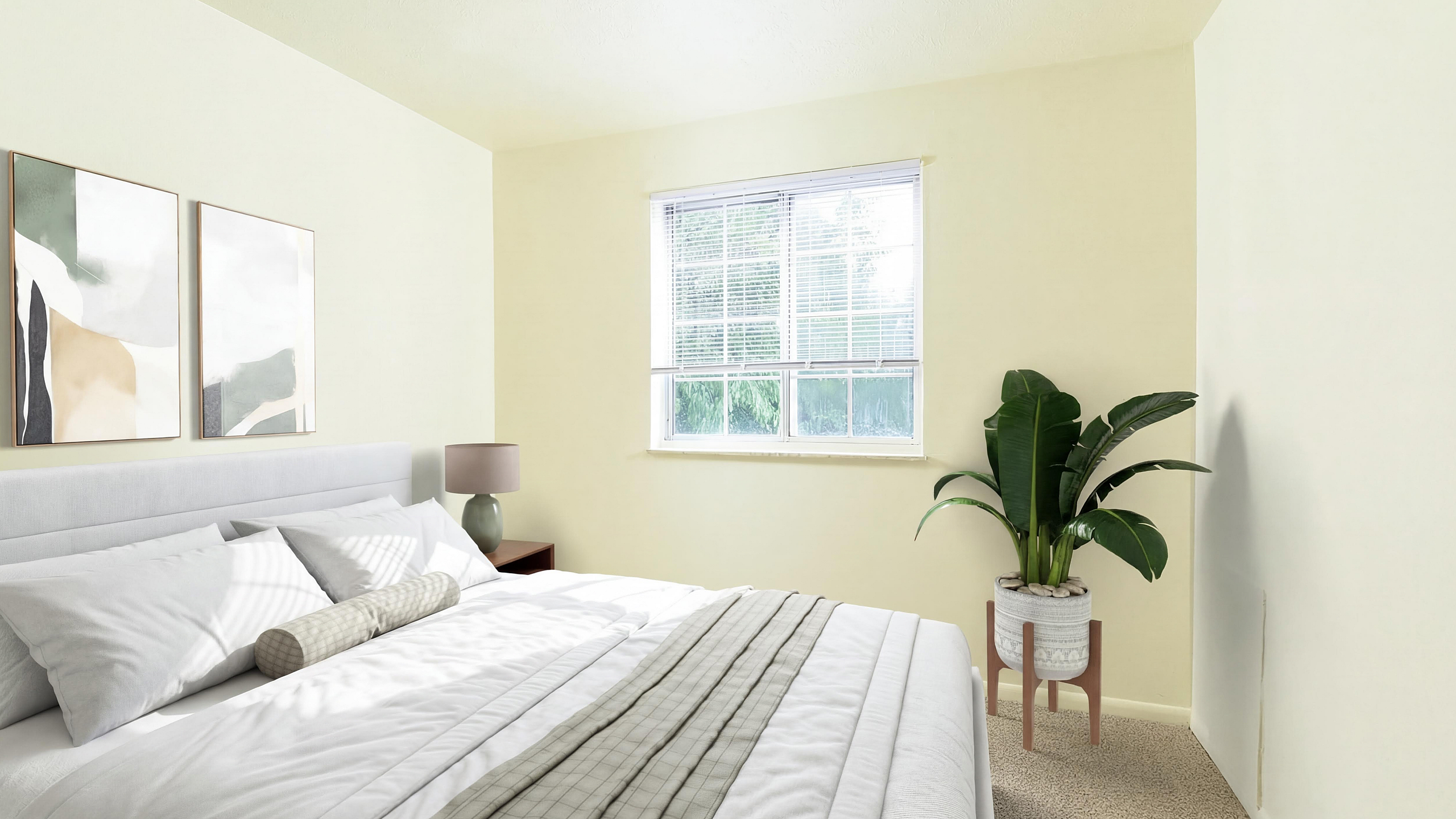 Bright and inviting bedroom featuring a large bed, elegant decor, and abundant natural light from a sizable window.