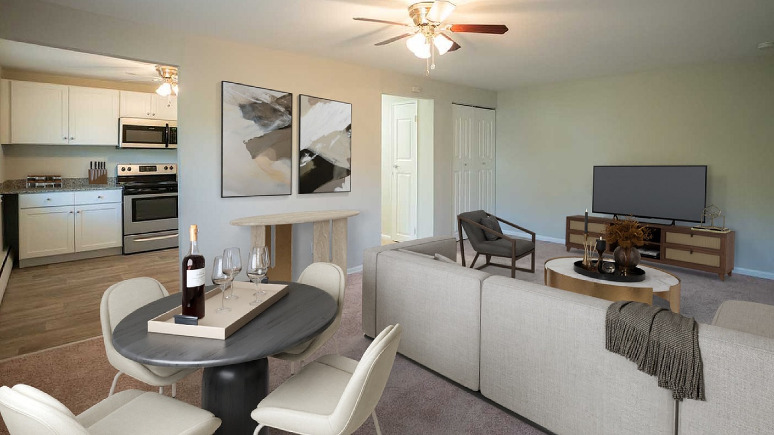 Inviting open-concept living space featuring a modern kitchen with stainless steel appliances, a chic dining area, and a cozy living room perfect for relaxation or entertaining.