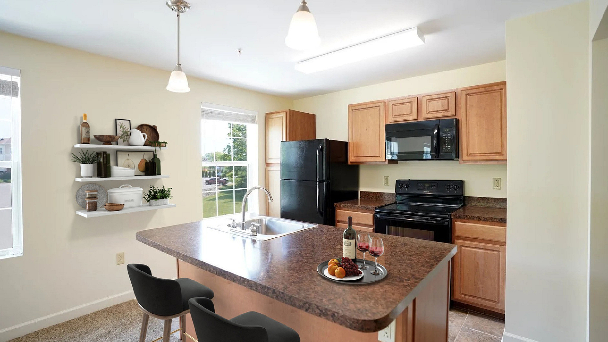 Modern kitchen with elegant wood cabinetry, sleek black appliances, and a chic island with stylish bar seating, perfect for entertaining.
