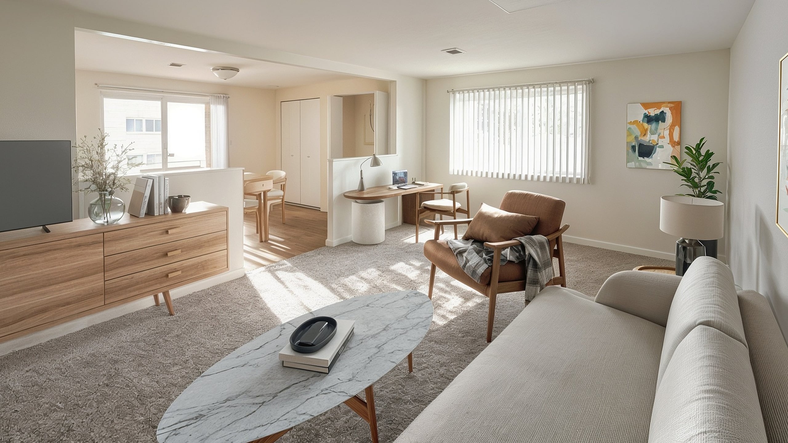 Bright and modern living room featuring a cozy sofa, sleek marble coffee table, and stylish wooden furniture with abundant natural light.