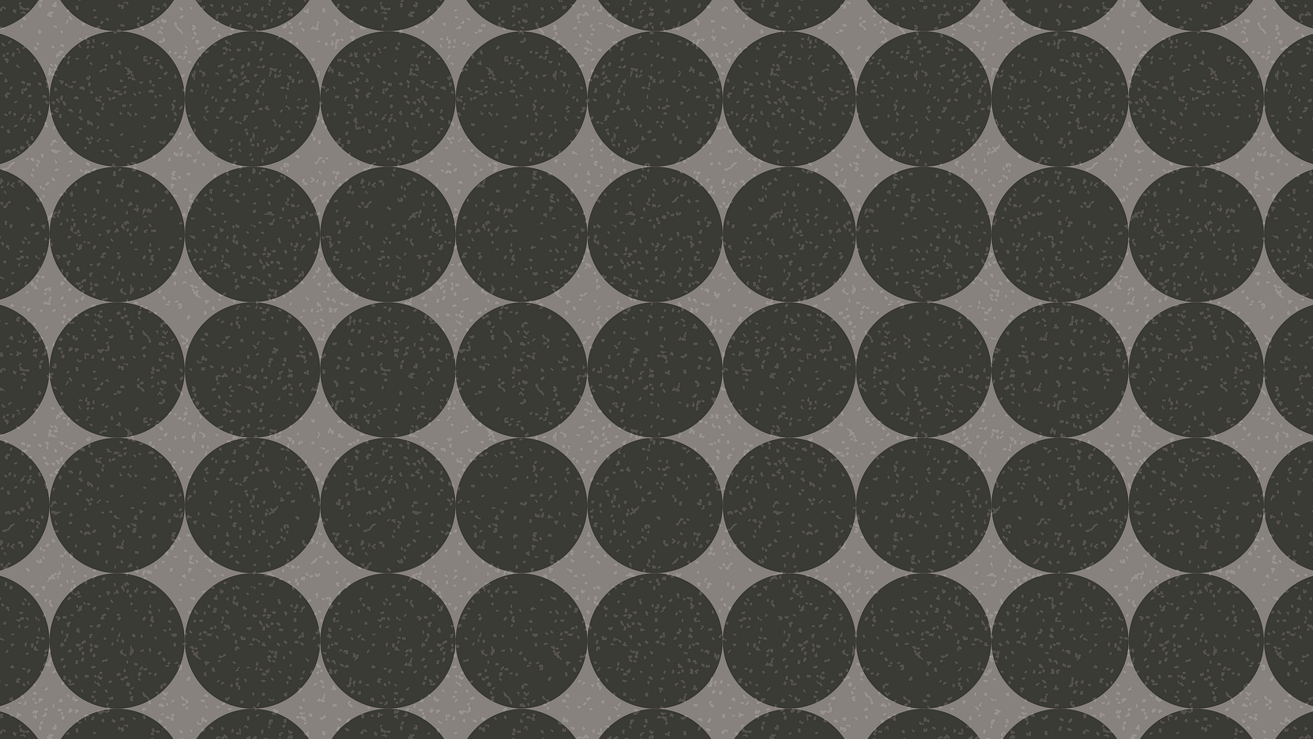 Chic geometric pattern featuring overlapping black circles against a soft gray background, ideal for modern interior design.