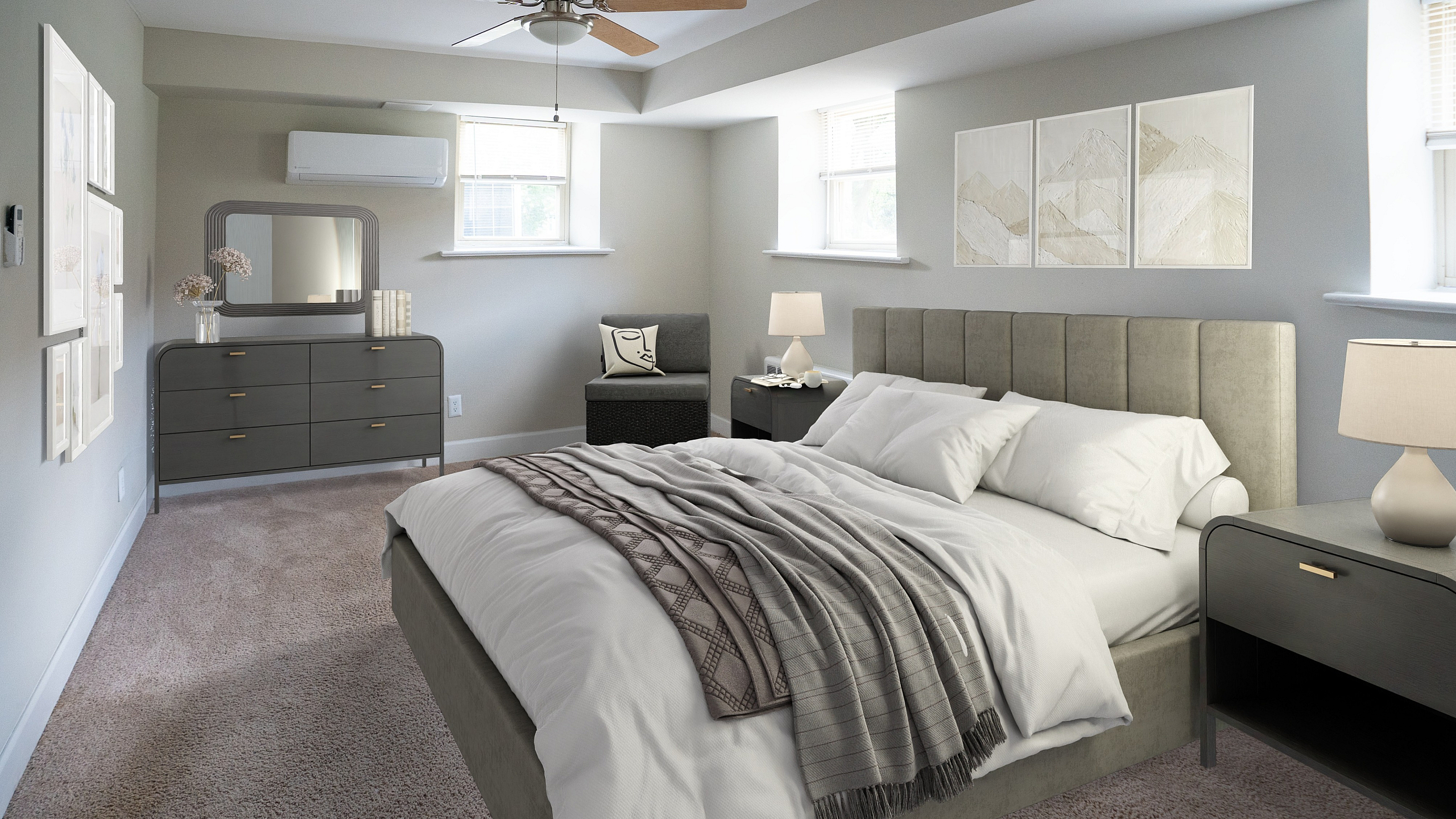Elegant bedroom featuring a plush bed with cozy linens, stylish gray dresser with mirror, and modern decor against soft gray walls, perfect for relaxation.