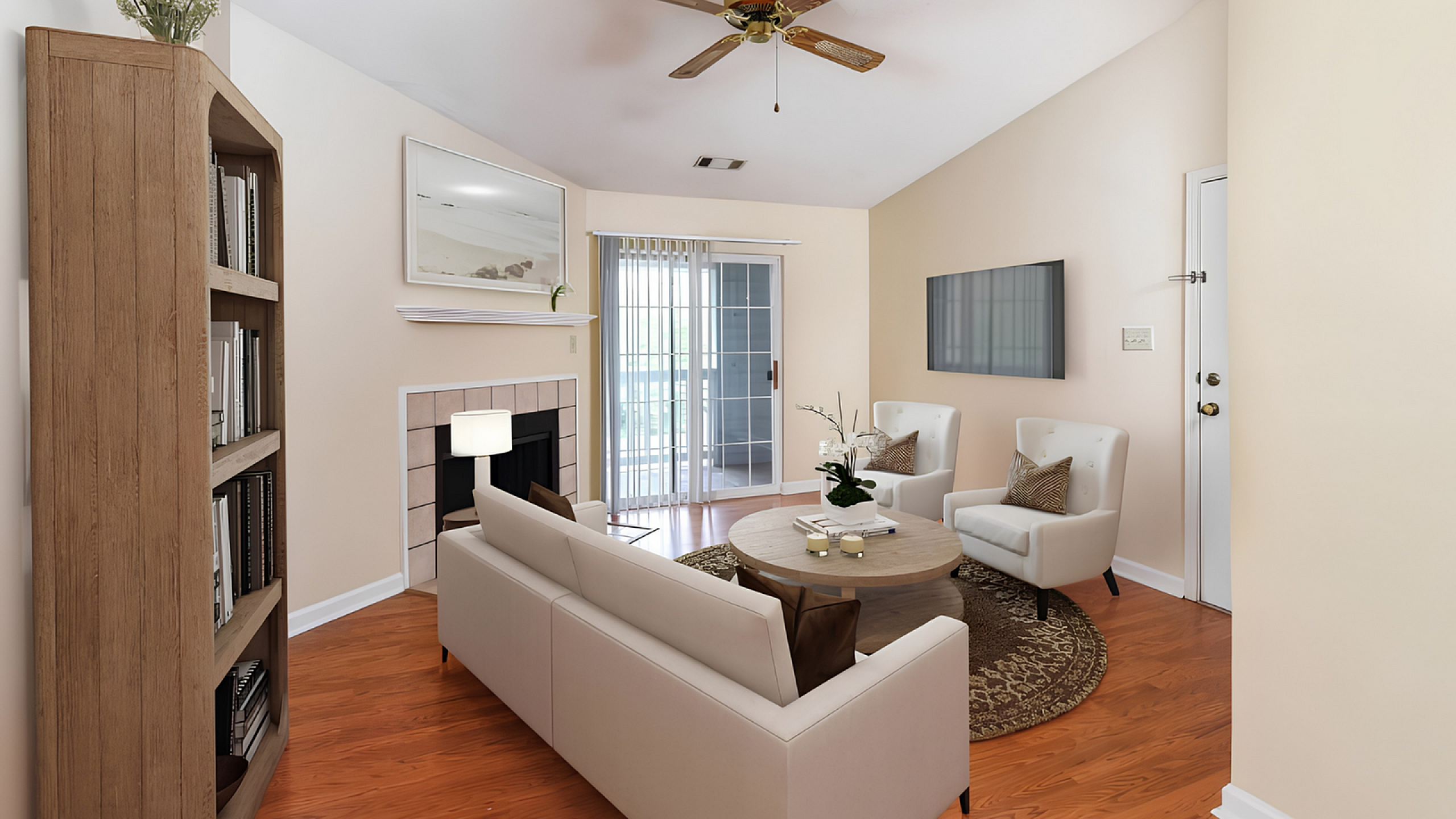 Charming living room with a cozy fireplace, elegant furnishings, and natural light streaming through glass doors, perfect for relaxation.