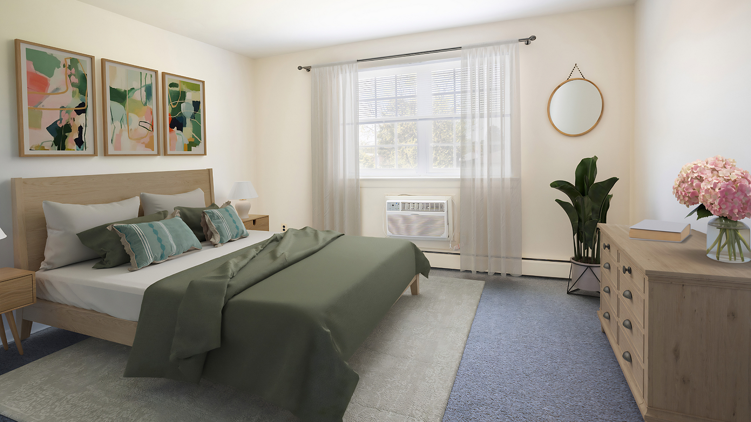 Bright and inviting bedroom with tasteful decor, featuring a plush bed adorned with green pillows, modern art on the walls, and natural light streaming through sheer curtains.