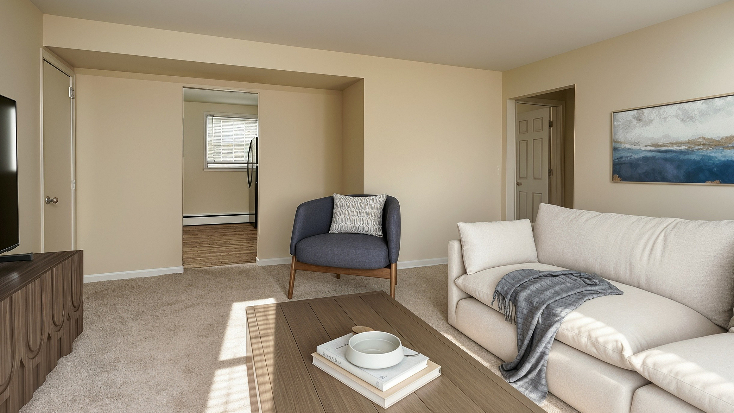 Inviting living room with cozy beige sofa, stylish armchair, and modern decor creating a warm ambiance.