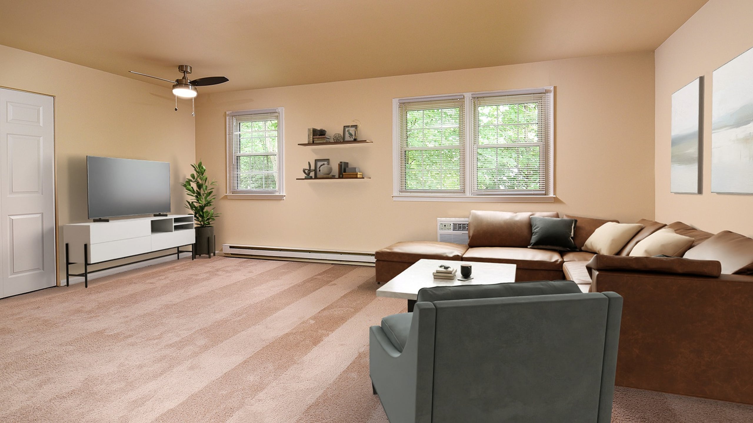 Inviting living room with plush carpet, modern sectional sofa, and a sleek entertainment center bathed in natural light from large windows.