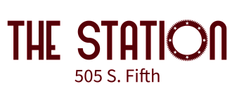 The Station logo with bold lettering and star-studded circle detailing, located at 505 S. Fifth.