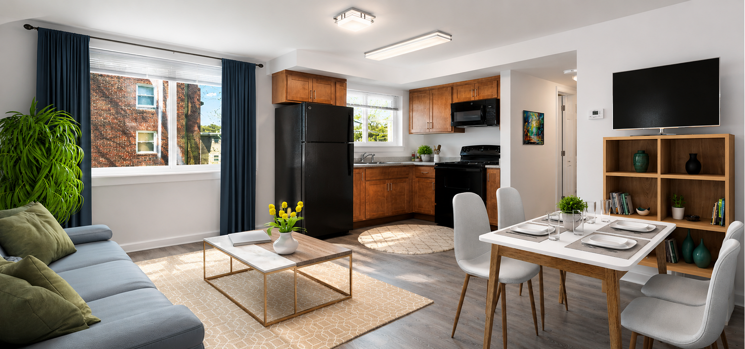 Bright and modern open-plan living area featuring a cozy lounge, stylish kitchen with wooden cabinetry, and elegant dining space.