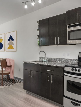 kitchen with espresso cabinets at milano apartments