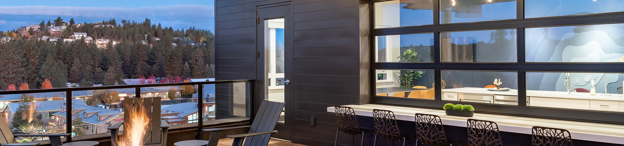 The Hixon rooftop deck and resident lounge with fire pit