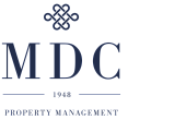 Elegant MDC Property Management logo featuring a sophisticated emblem and bold text emphasizing trust and reliability since 1948.
