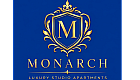 Elegant Monarch logo showcasing luxury and sophistication with a golden crest on a royal blue background.
