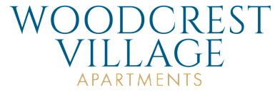 Elegant Woodcrest Village Apartments logo in sophisticated blue and gold typography.