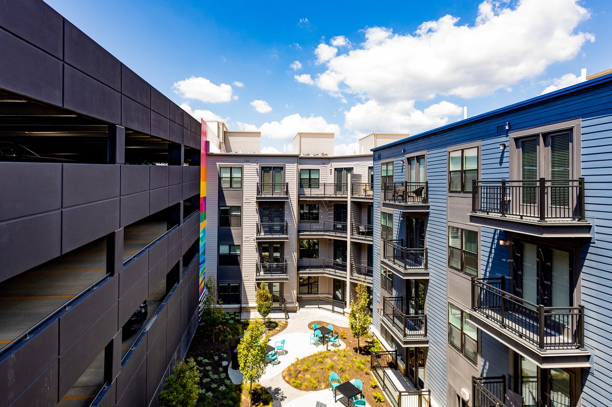 Landscaped courtyard and private apartment balconies at Woodburn Exchange in East Walnut Hills, Cincinnati