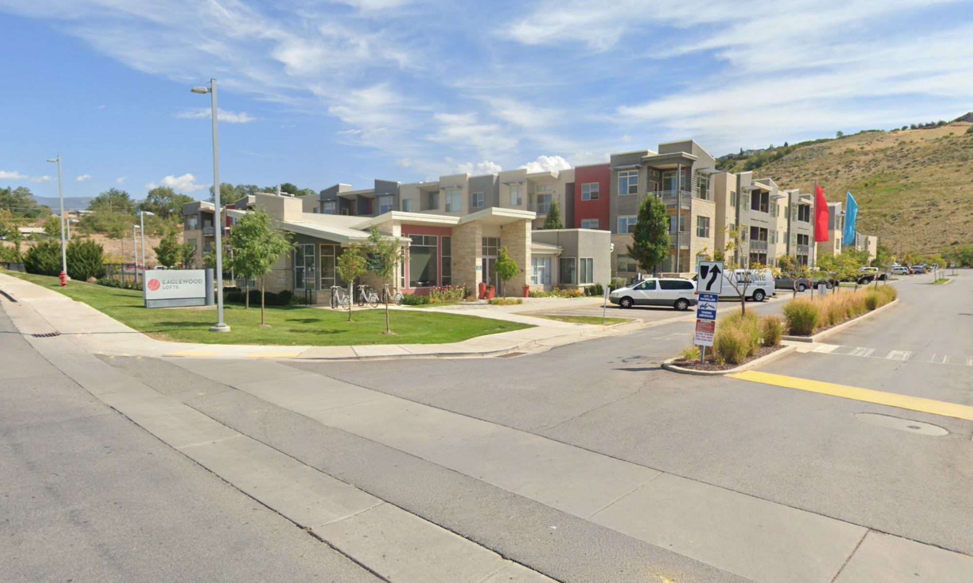 Scenic view near Eaglewood Lofts in North Salt Lake with community buildings and mountain backdrop.