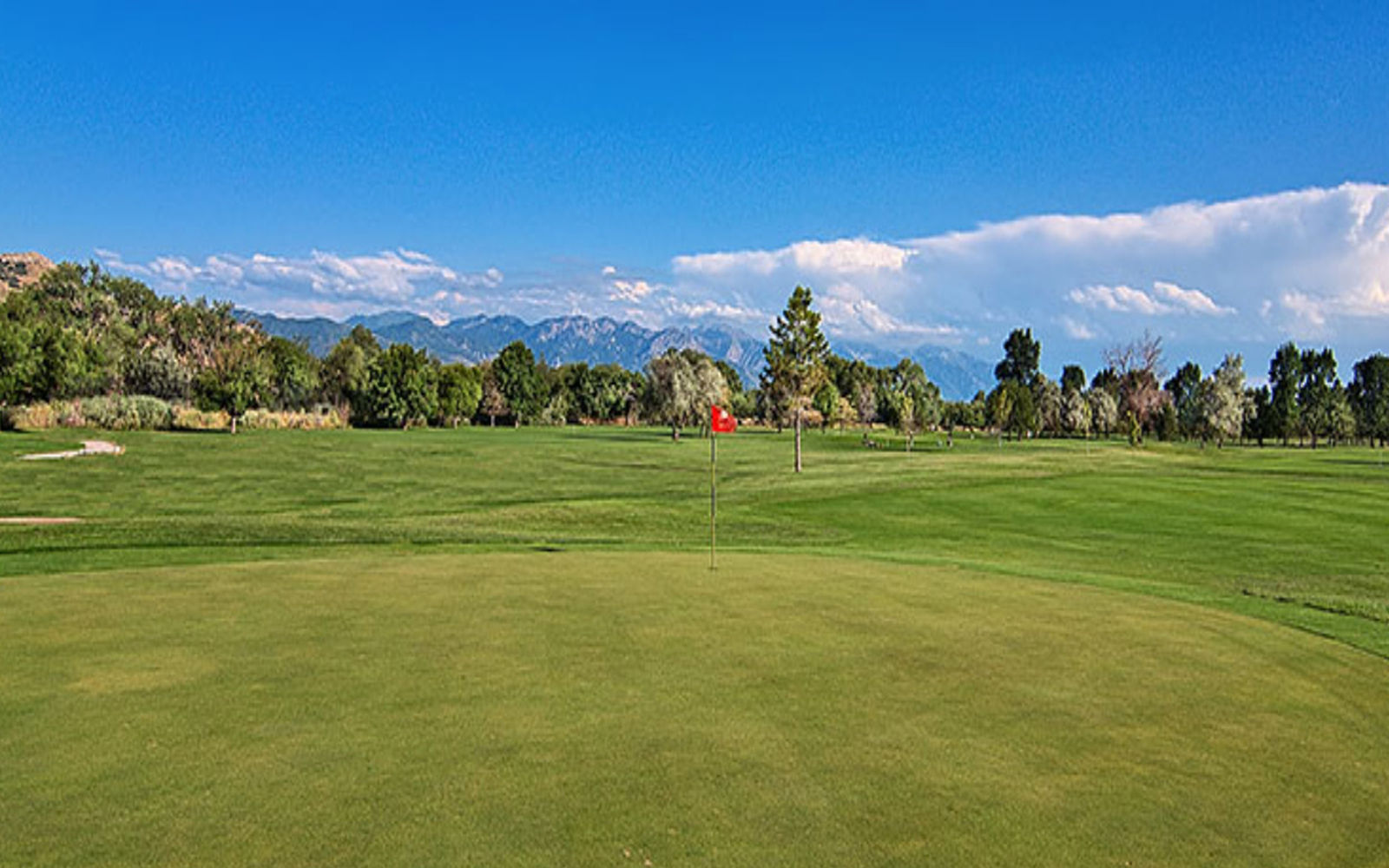 Rose Park Golf Course near Salt Lake City featuring open fairways and mountain views.