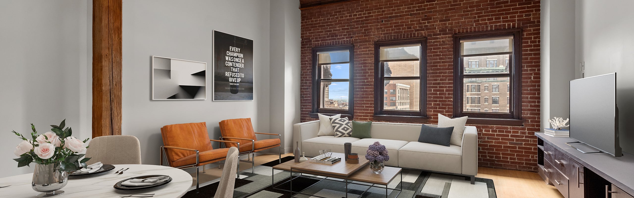 Inviting urban apartment featuring exposed brick walls, modern furnishings, and a cozy dining area.