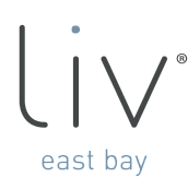 Minimalist logo featuring 'liv east bay' in sleek typography with a modern dot design.