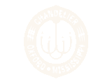 Elegant emblem featuring a chandelier motif with 'Chandelier Oxford Mississippi' text, radiating sophistication and charm.