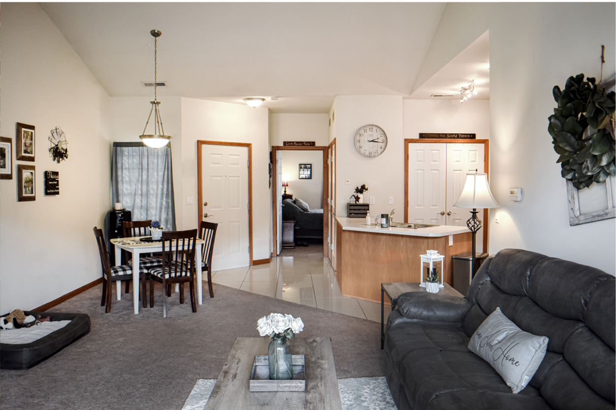 interior of a crowood pointe living room and kitchen