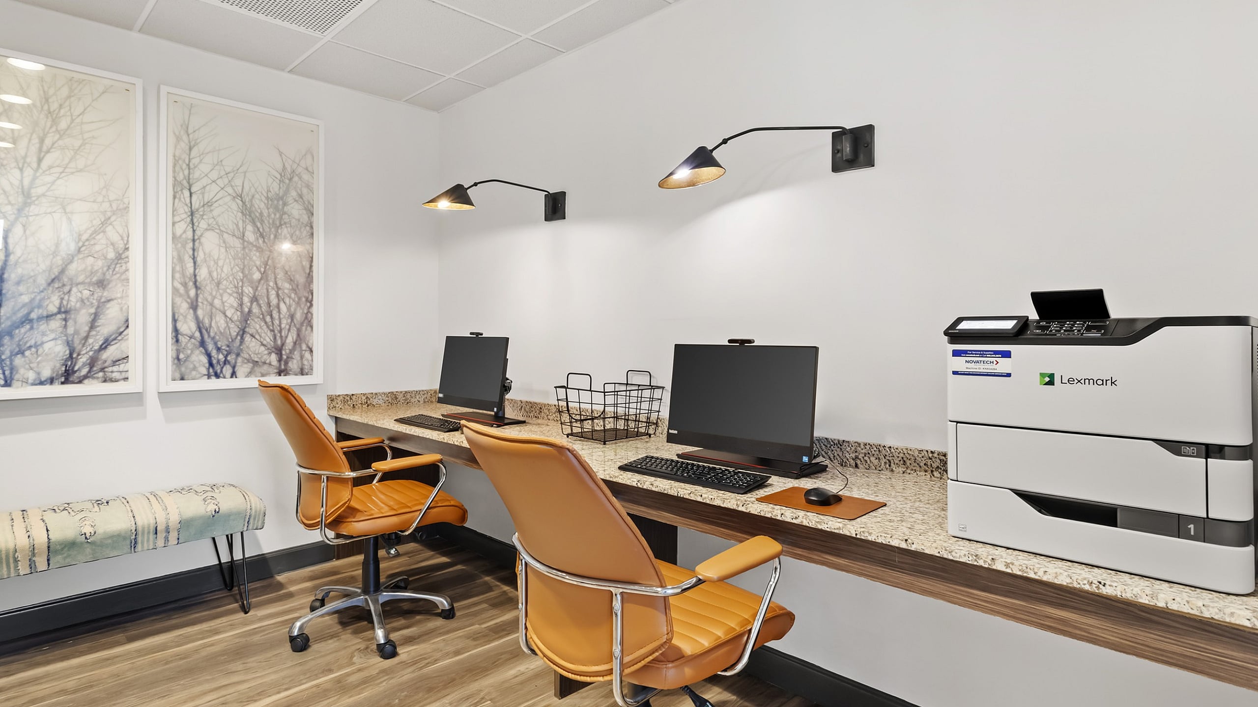 Computer workstations with stylish chairs for residents at 303 Flats student apartments in Knoxville, TN