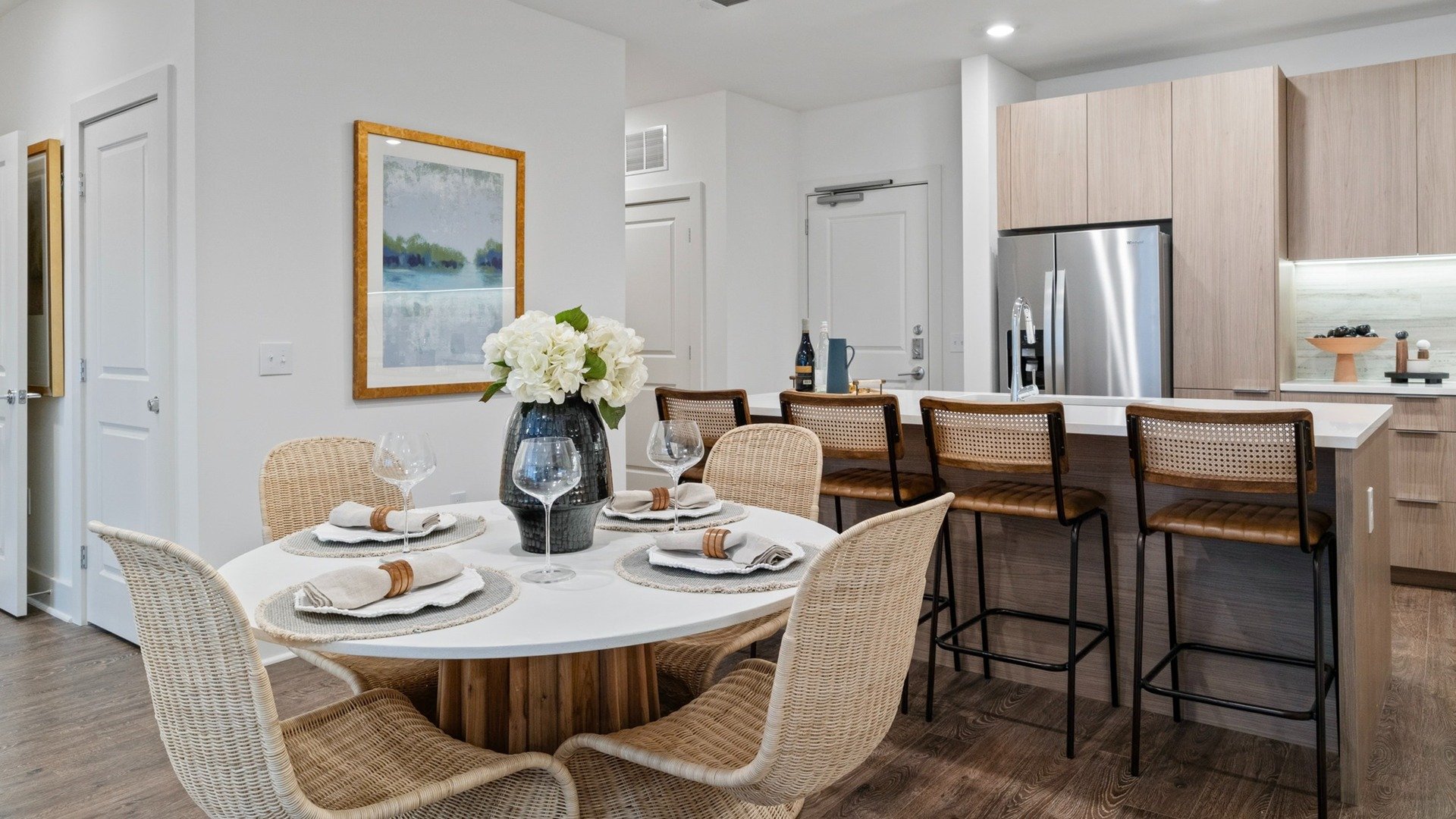 kitchen photo with white cabinets and black countertops