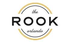 Elegant logo design featuring 'The Rook Orlando' with a sophisticated circular motif and gold accents.