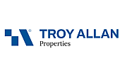 Logo of Troy Allan Properties featuring a modern blue geometric design and text.