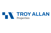Modern Troy Allan Properties logo featuring a sleek blue geometric design and bold lettering, symbolizing trust and innovation in real estate.