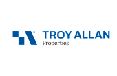 Modern Troy Allan Properties logo in bold blue and black font with geometric design.