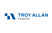 Bold and modern Troy Allan Properties logo featuring a sleek geometric design in vibrant blue.