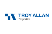 Logo of Troy Allan Properties featuring a sleek blue design element and modern typography.