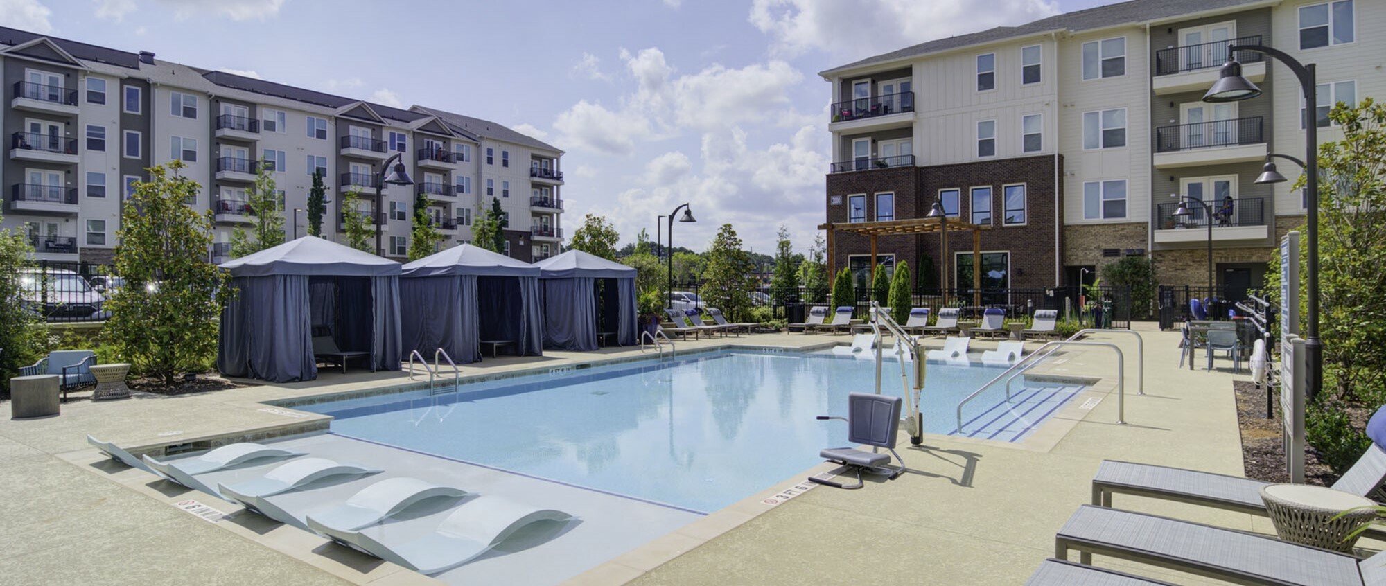 exterior pool with apartment buildings in daytime